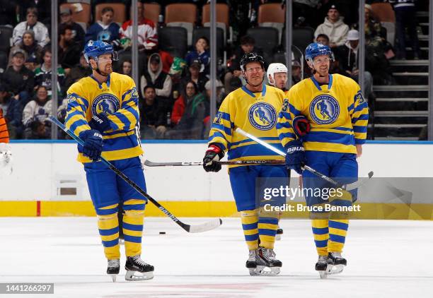 Daniel Sedin, Daniel Alfredsson and Henrik Sedin skate in the HHoF Legends Classic game at the Scotiabank Arena on November 13, 2022 in Toronto,...