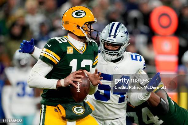 Sam Williams of the Dallas Cowboys sacks Aaron Rodgers of the Green Bay Packers during the third quarter at Lambeau Field on November 13, 2022 in...