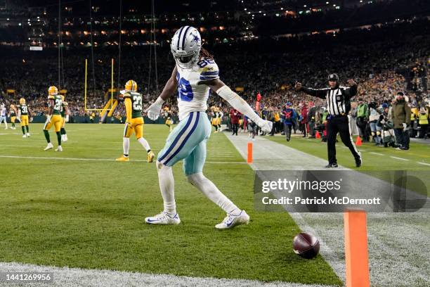 CeeDee Lamb of the Dallas Cowboys celebrates after scoring a touchdown during the third quarter against the Green Bay Packers at Lambeau Field on...