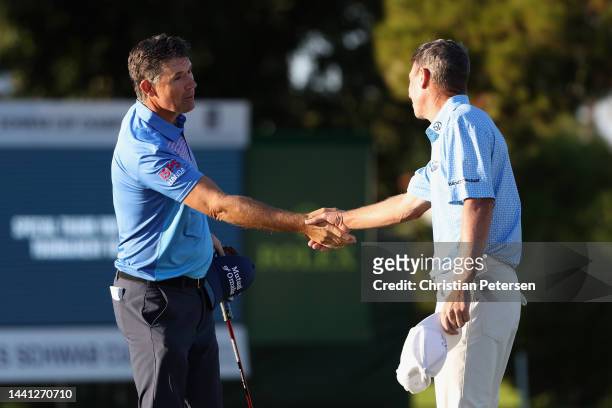 Padraig Harrington of Ireland shakes hands with Steven Alker of New Zealand after winning the Charles Schwab Cup Championship at Phoenix Country Club...