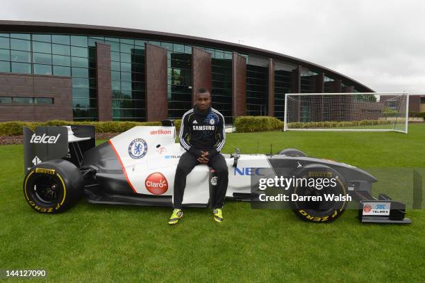 Salomon Kalou of Chelsea next to the Sauber F1 car to launch the Chelsea FC and Sauber partnership at the Cobham training ground on May 10, 2012 in...