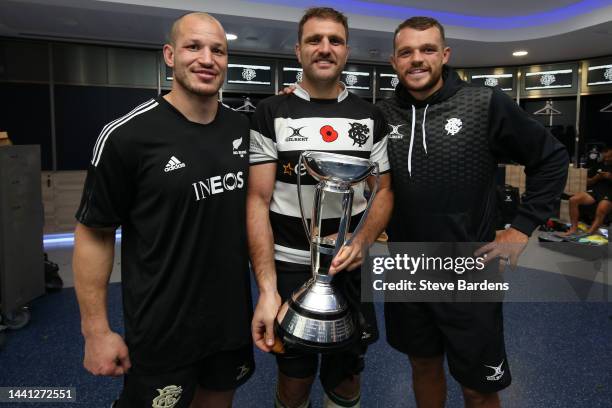 Wenceslas Lauret, Luke Whitelock and Zach Mercer of the Barbarians celebrate wth the Killik Cup in the Barbarians dressing room after the Killik Cup...