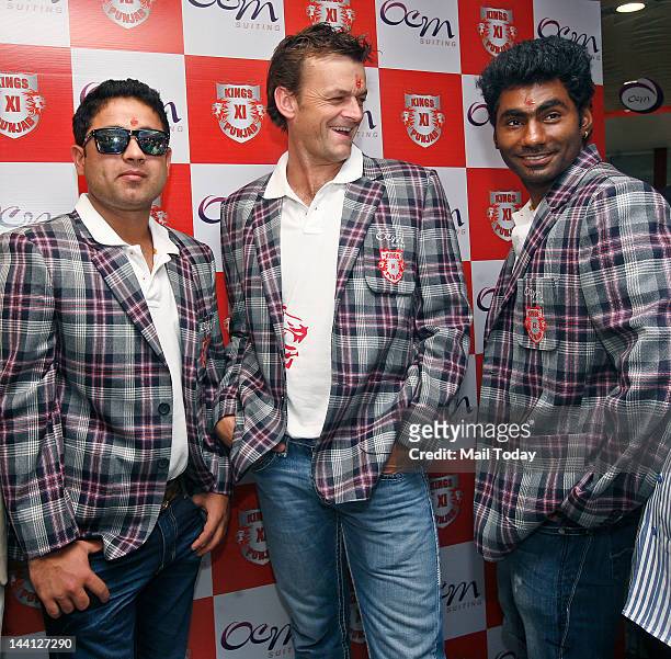 Kings XI Punjab team Members Adam Gilchrist, Piyush Chawla and Parvinder Awana at a event in Delhi on Wednesday.