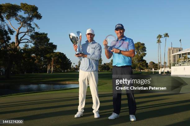 Steven Alker of New Zealand poses with the Charles Schwab Cup and Padraig Harrington of Ireland poses with the Charles Schwab Cup Championship trophy...