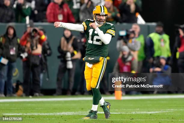 Aaron Rodgers of the Green Bay Packers celebrates after a play during overtime against the Dallas Cowboys at Lambeau Field on November 13, 2022 in...