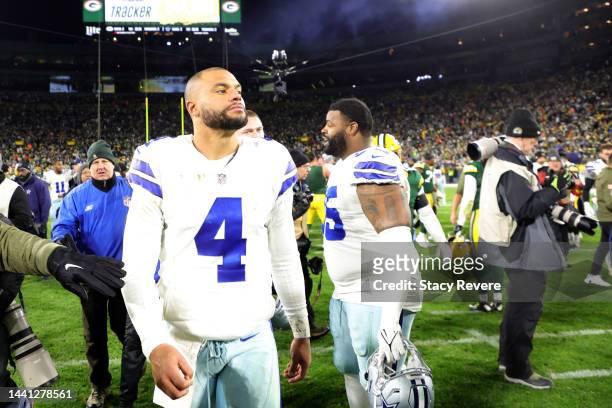 Dak Prescott of the Dallas Cowboys walks off the field after his teams 31-28 overtime loss against the Green Bay Packers at Lambeau Field on November...
