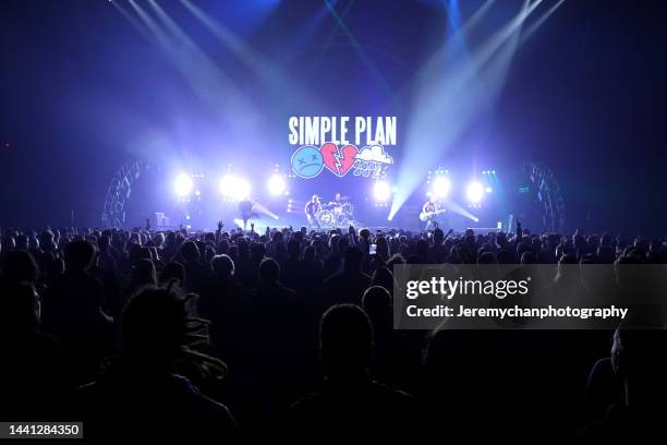 Jeff Stinco, Pierre Bouvier, Chuck Comeau, and Sébastien Lefebvre of Simple Plan perform at Meridian Centre on November 13, 2022 in St. Catharines,...