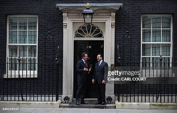 British Prime Minister David Cameron and Pakistan's Prime Minister Yousuf Raza Gilani pose for pictures after a meeting at 10 Downing Street, London,...