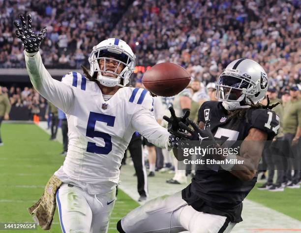 Cornerback Stephon Gilmore of the Indianapolis Colts breaks up a pass intended for wide receiver Davante Adams of the Las Vegas Raiders in the end...