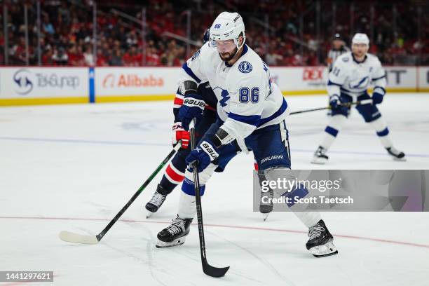 Nikita Kucherov of the Tampa Bay Lightning skates with the puck as Garnet Hathaway of the Washington Capitals defends during the third period of the...