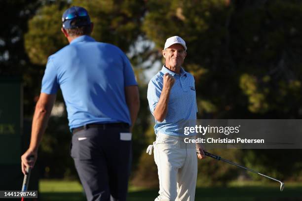 Steven Alker of New Zealand celebrates, alongside Padraig Harrington of Ireland after winning the Charles Schwab Cup following the final round the...