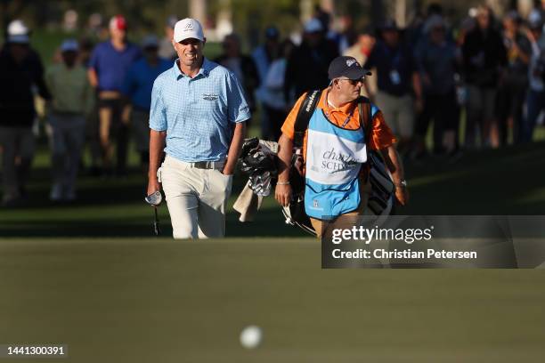 Steven Alker of New Zealand and caddie Sam Workman walk up to the 18th green during the final round the Charles Schwab Cup Championship at Phoenix...