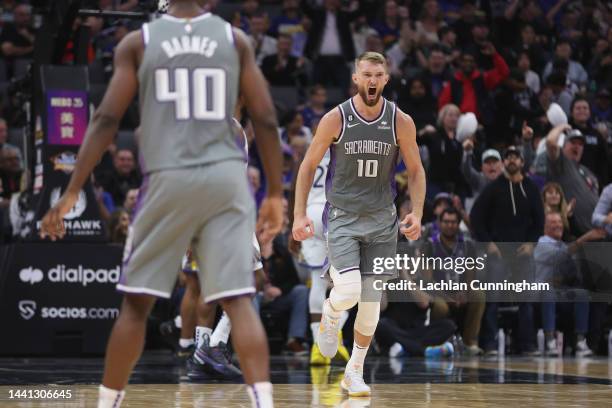 Domantas Sabonis of the Sacramento Kings celebrates after a basket in the fourth quarter against the Golden State Warriors at Golden 1 Center on...