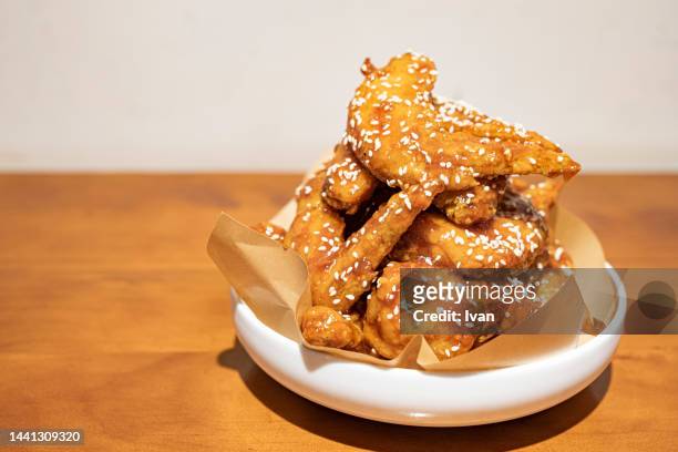 directly above shot of dakgangjeong  korean fried chickens  on table - korean culture fotografías e imágenes de stock