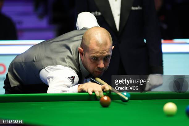 Barry Hawkins of England plays a shot in the first round match against Ding Junhui of China on day 2 of 2022 Cazoo UK Championship at Barbican Centre...