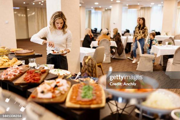 family enjoying breakfast buffet together in the hotel - salad bar stock pictures, royalty-free photos & images