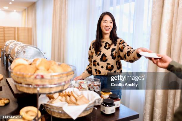 woman handing dessert plate to her boyfriend - food bar stock pictures, royalty-free photos & images