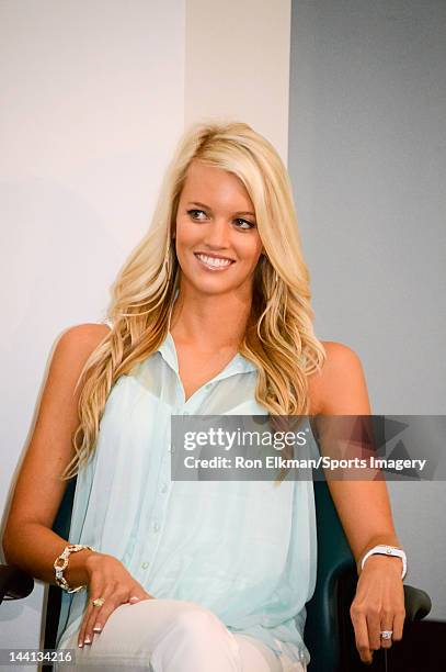 Lauren Tannehill, wife of Ryan Tannehill, looks on as Ryan Tannehill is introduced at a press conference at the Miami Dolphins training facility on...