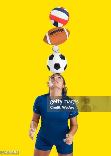 woman balancing sports balls on head - sports equipment stock pictures, royalty-free photos & images