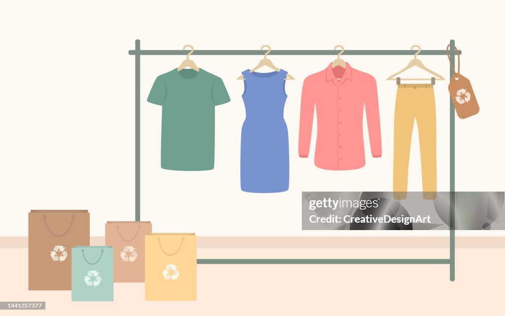 Sustainable Fashion Store With Recycled Clothes Hanging On Rack. Sustainable Fashion And Environmental Protection Concept