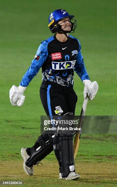 Tegan McPharlin of the Adelaide Strikers leaves the ground after getting run out for 0 to during the Women's Big Bash League match between the...