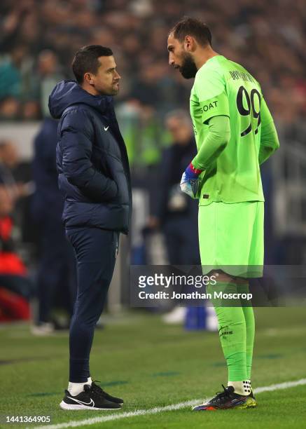 Joao Sacramento Assistant Coach of PSG discusses with Gianluigi Donnarumma during the UEFA Champions League Group H match between Juventus and Paris...