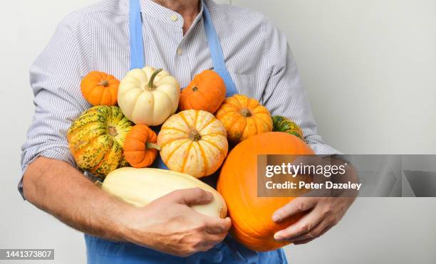 farmer with pumpkins and squash - naughty halloween stock pictures, royalty-free photos & images