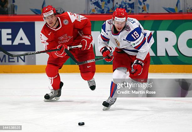 Jannik Hansen of Denmark and Denis Kokarev of Russia battle for the puck during the IIHF World Championship group S match between Denmark and Russia...