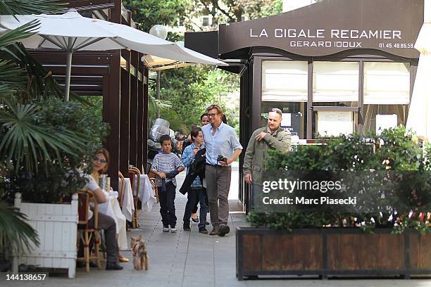 Actor Simon Baker, wife Rebecca Rigg and their chidren leave the 'La Cigale Recamier' restaurant on May 10, 2012 in Paris, France.