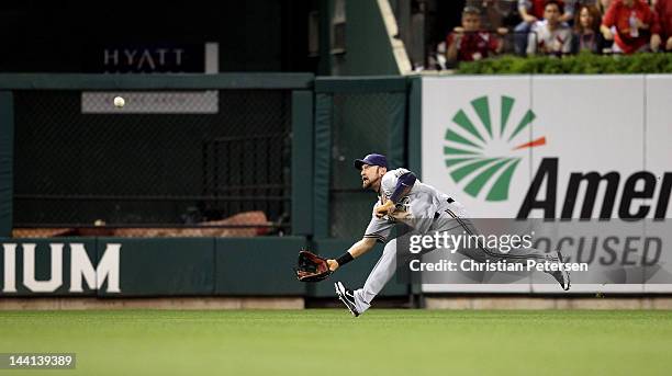 Mark Kotsay of the Milwaukee Brewers can't make a play on a double hit by Jon Jay of the St. Louis Cardinals in the bottom of the first inning during...