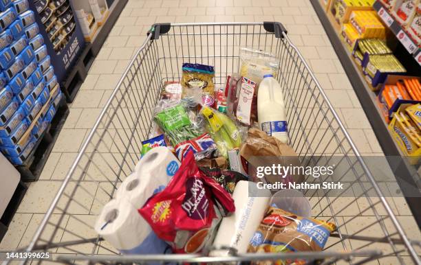 Shopping trolley is filled with groceries at a Lidl supermarket store on November 14, 2022 in Newcastle Under Lyme, England.