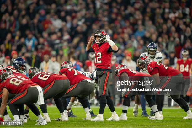 Tom Brady of the Tampa Bay Buccaneers talks to his team mates during the NFL match between Seattle Seahawks and Tampa Bay Buccaneers at Allianz Arena...