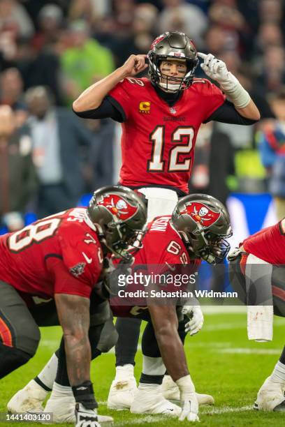 Tom Brady of the Tampa Bay Buccaneers talks to his team mates during the NFL match between Seattle Seahawks and Tampa Bay Buccaneers at Allianz Arena...