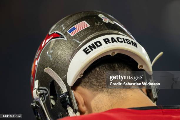 The words "End Racism" are seen on a helmet of a player of the Tampa Bay Buccaneers during the NFL match between Seattle Seahawks and Tampa Bay...