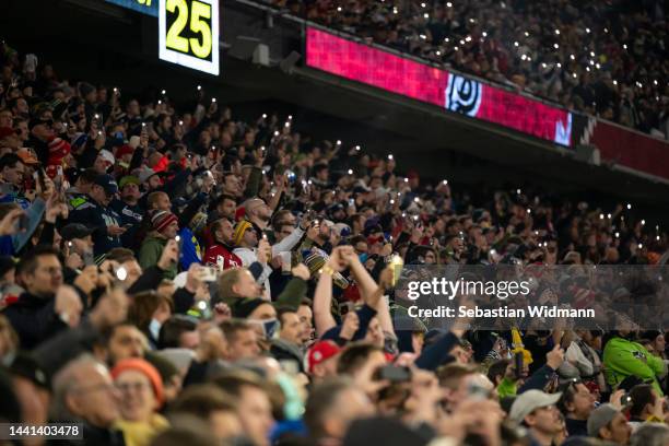 Fans cheer during the NFL match between Seattle Seahawks and Tampa Bay Buccaneers at Allianz Arena on November 13, 2022 in Munich, Germany.