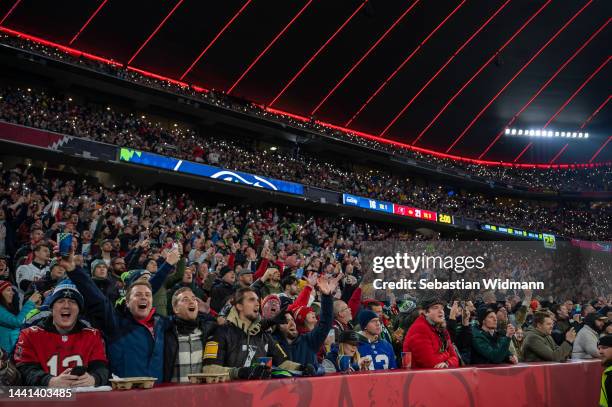Fans cheer during the NFL match between Seattle Seahawks and Tampa Bay Buccaneers at Allianz Arena on November 13, 2022 in Munich, Germany.