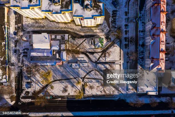 winter city street drone photography. sunny day. flying above earth. background. first snow aerial view - helicopter point of view stock pictures, royalty-free photos & images