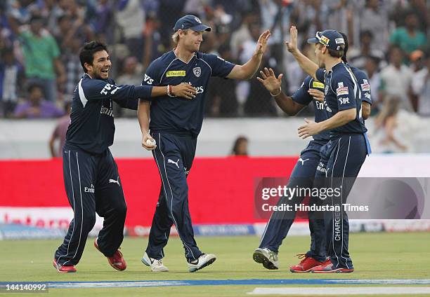 Deccan Chargers player Cameroon White celebrates with teammates after taking catch of Delhi Daredevil Captain Virender Sehawag during IPL T20 match...