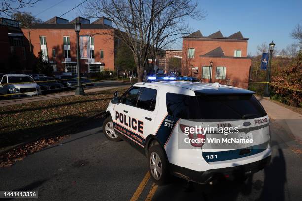 Law enforcement blocks access to the crime scene where 3 people were killed and 2 others wounded on the grounds of the University of Virginia on...