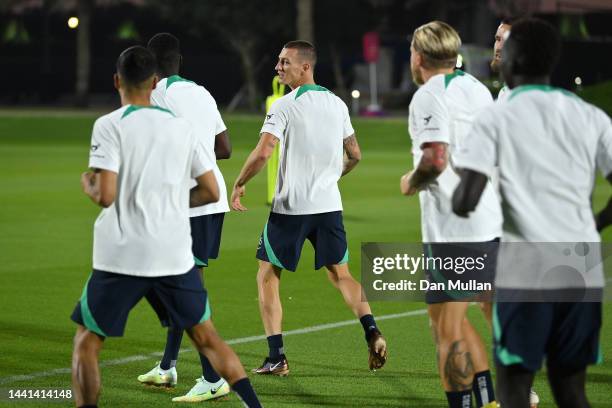 Mitch Duke of Australia warms up with his team mates during a training session at AspireZoneTraining Facilities on November 14, 2022 in Doha, Qatar.