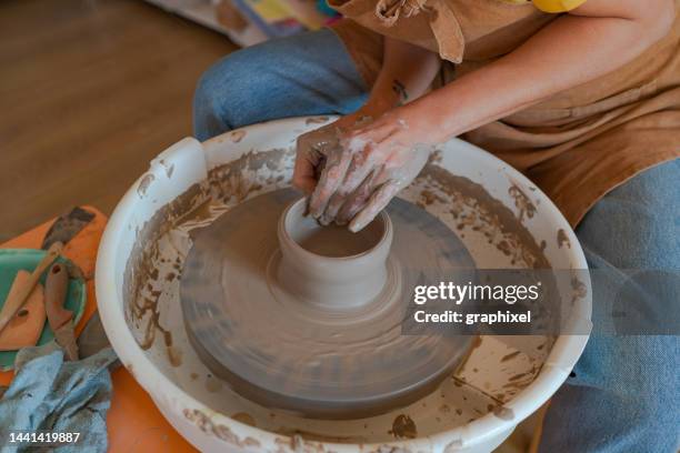 potter making bowl on wheel - heritage round one stock pictures, royalty-free photos & images