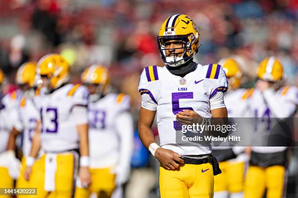 Jayden Daniels of the LSU Tigers warms up before a game against the Arkansas Razorbacks at Donald W. Reynolds Razorback Stadium on November 12, 2022...