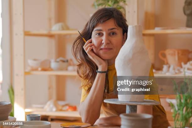 portrait of woman with handmade pottery - art and craft stock pictures, royalty-free photos & images