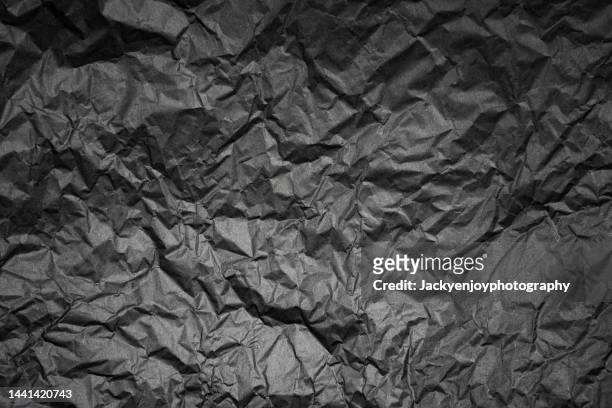 black paper - crumpled paper stockfoto's en -beelden