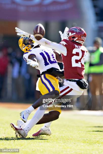 Jaray Jenkins of the LSU Tigers goes up for a pass that is broken up by Quincey McAdoo of the Arkansas Razorbacks at Donald W. Reynolds Razorback...