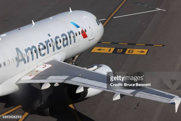 An American Airlines jet moves along the runway at Laguardia AIrport on November 10, 2022 in the Queens borough of New York City. The airline...