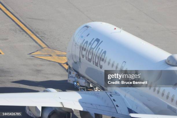 JetBlue jet moves along the runway at Laguardia AIrport on November 10, 2022 in the Queens borough of New York City. The airline industry has...