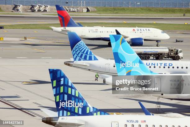 Airplanes from Delta, United and JetBlue populate the taxiway at Laguardia AIrport on November 10, 2022 in the Queens borough of New York City. The...