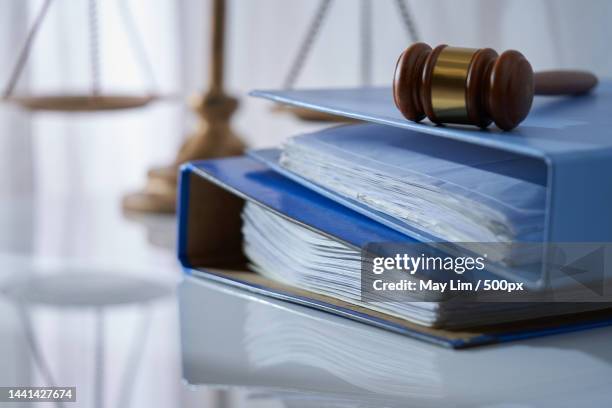 gavel hammer on stack of document libra scale as background,malaysia - law imagens e fotografias de stock