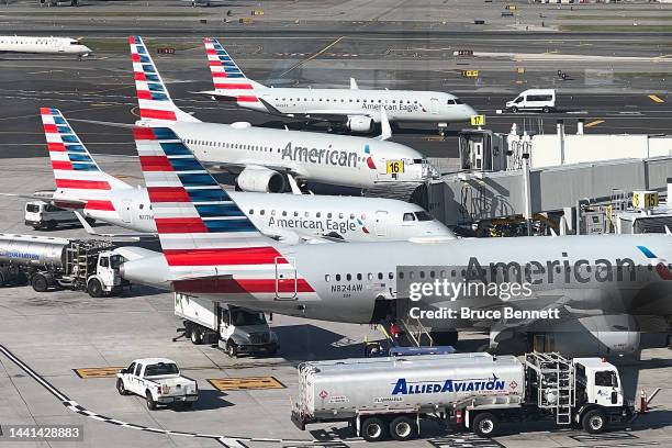 American Airlines jets are parked at their gates at Laguardia AIrport on November 10, 2022 in the Queens borough of New York City. The airline...